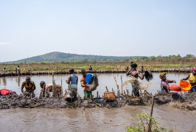 Community fishing outside Chinko